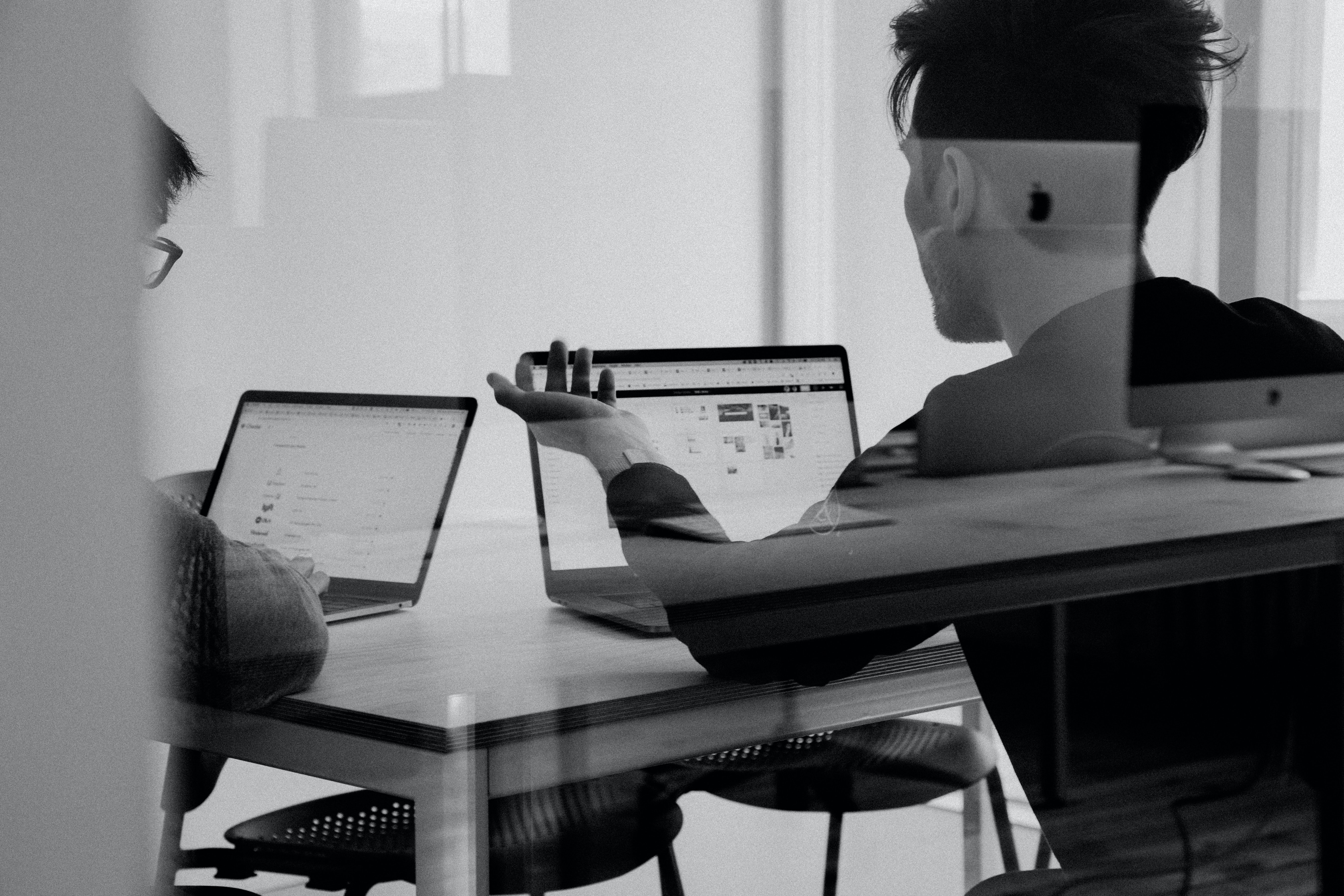 investor working on laptop managing his portfolio